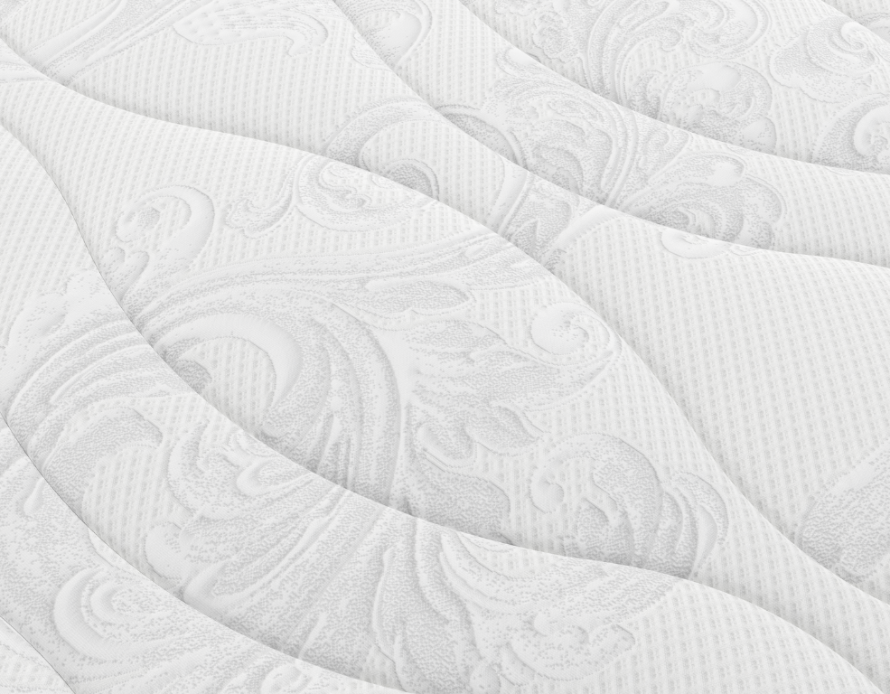 Close-up of a white quilted mattress cover with a subtle pattern.