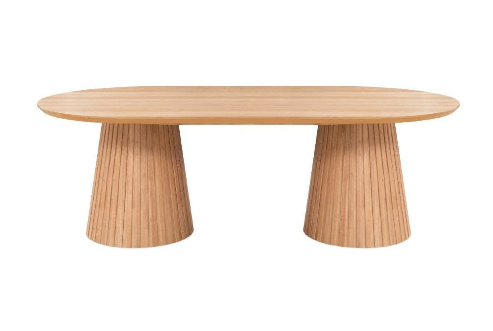 A natural oak finish dining table with a curved tabletop and a ribbed cylinder base.