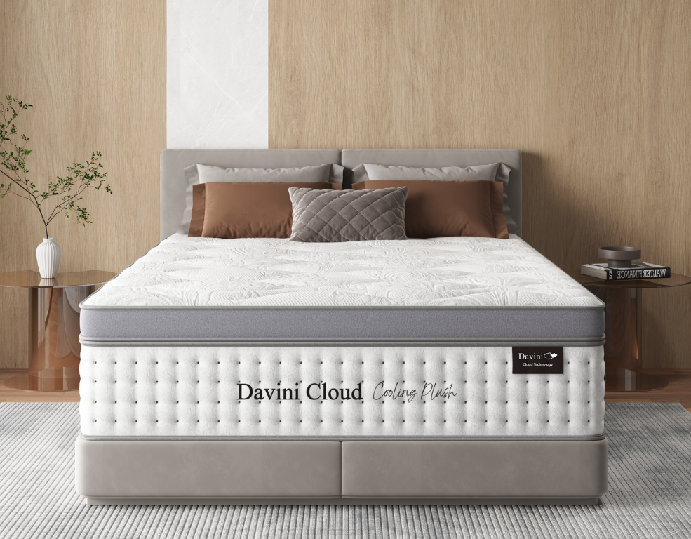Davini Cloud mattress in a bedroom setting with fabric headboard and bedside tables.