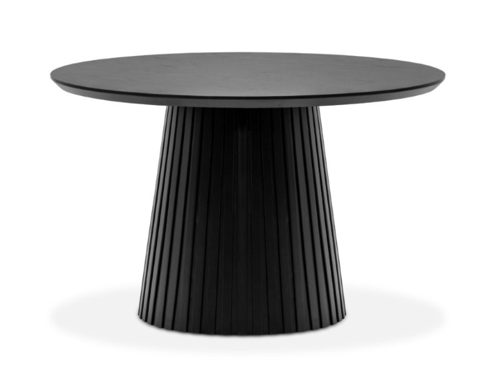 A round black dining table with a ribbed base.