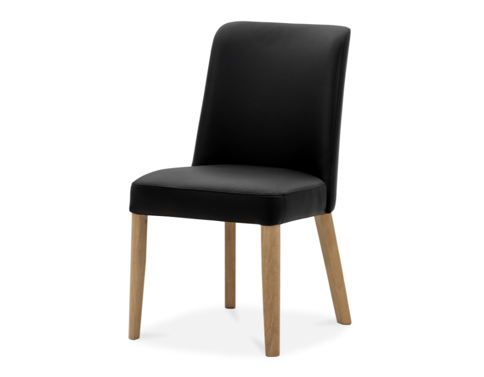 Black leather upholstered chair with oak legs on a white background on slight angle