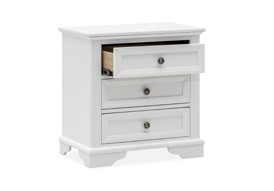 White bedside table with three drawers on a white background